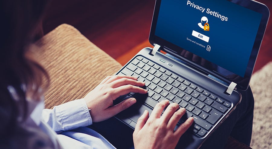 woman typing on laptop