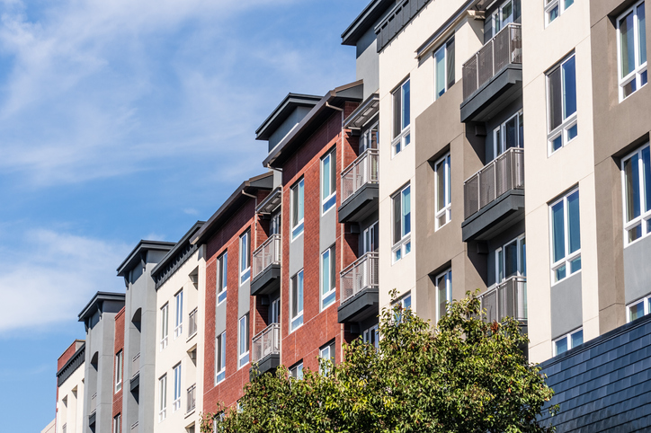 Exterior view of modern apartment building offering luxury rental units.