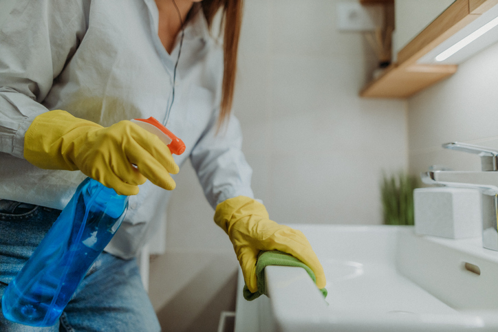 woman cleaning at a sink