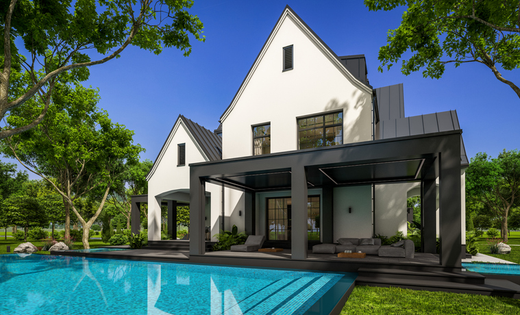 The back of a white house with a nice pool and deck